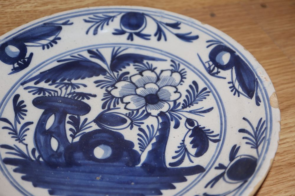 A collection of five 18th century Delft dishes, largest diameter 23cm
